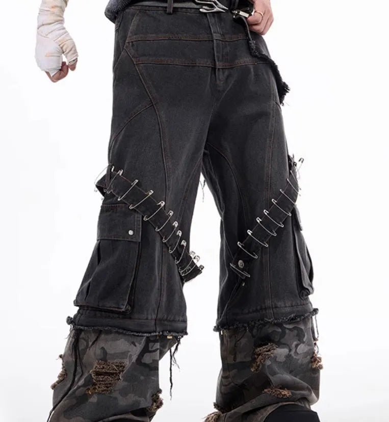 Men's grey camouflage jeans with splicing panel design and decorative pin and ribbon details