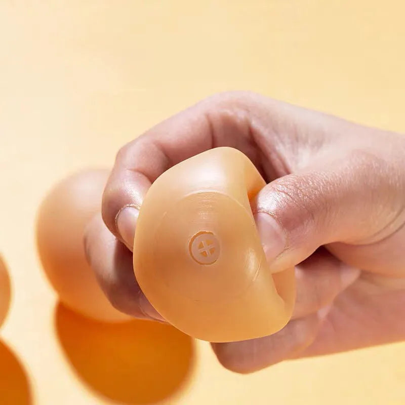 Green durable rubber dog chew ball toy with sound simulation egg inside for teeth cleaning.