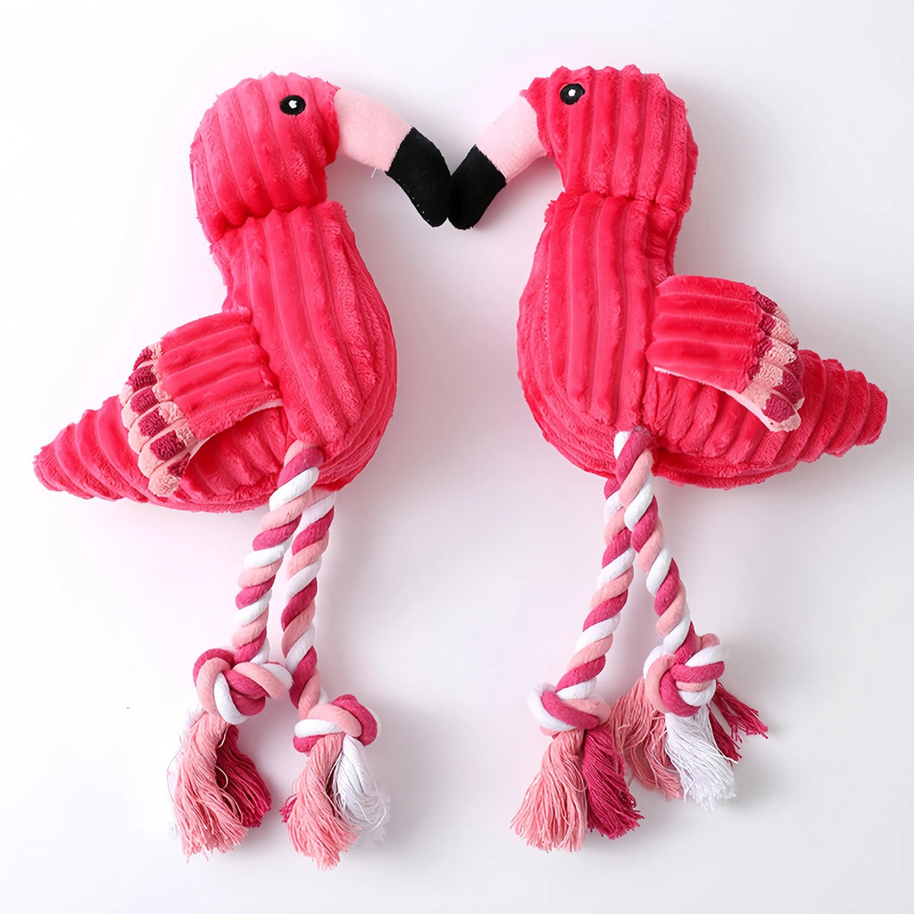 Pink corduroy hippo and parrot squeaky plush dog toys on a white background.