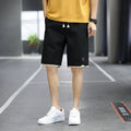 Men's loose-fit straight-leg casual beach shorts in polyester, shown in 8905 Green colour.
