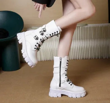 Women's black mid-calf boots with a metal buckle strap and side zipper, made of artificial PU leather.