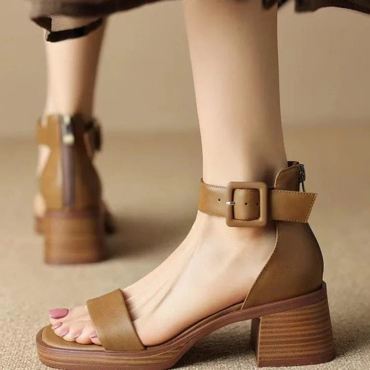 White women's retro platform high heels with an ankle strap and round toe.