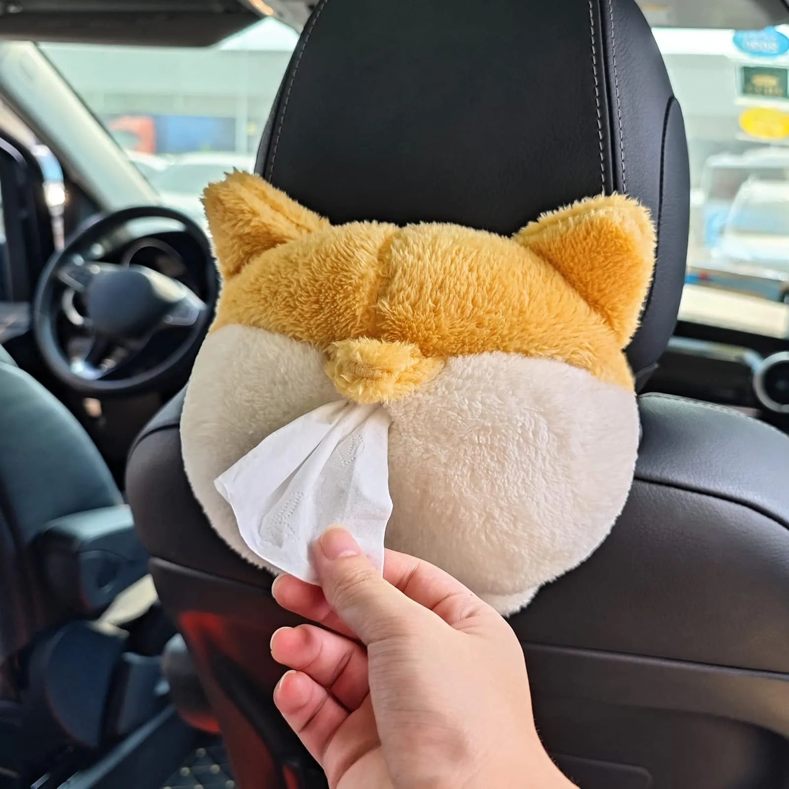 Yellow soft plush corgi butt shaped car tissue holder with elastic hanging straps.