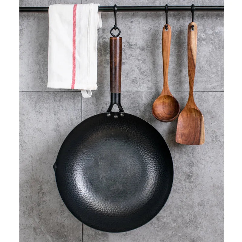 Traditional black iron wok pan with wooden handle measuring 40cm