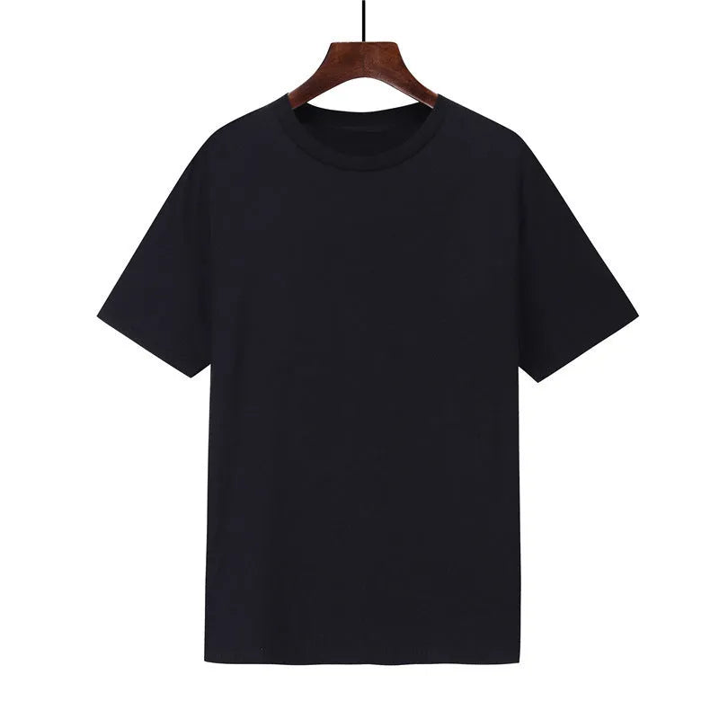 Men's loose fit black cotton t-shirt with short sleeves on a hanger.