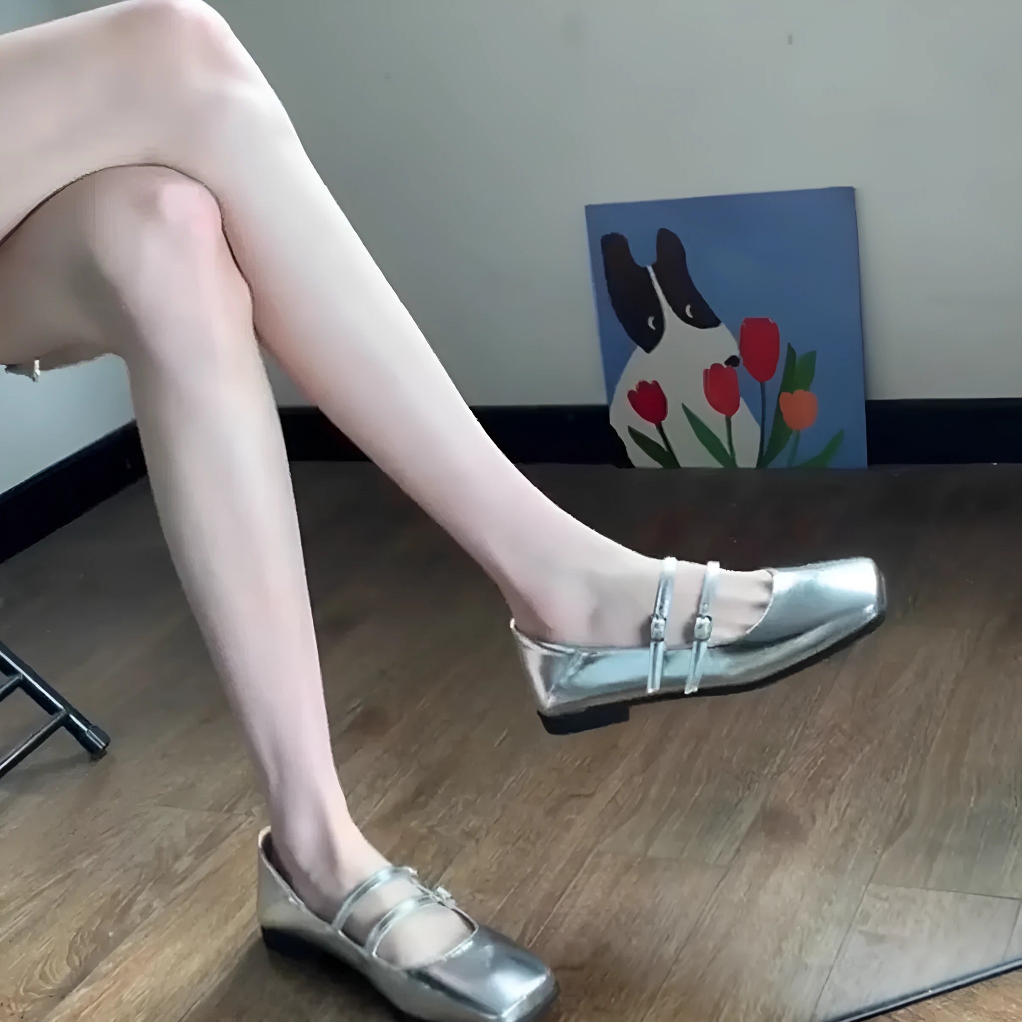 Women's silver genuine leather Mary Jane flats with a cross buckle strap and round toe.