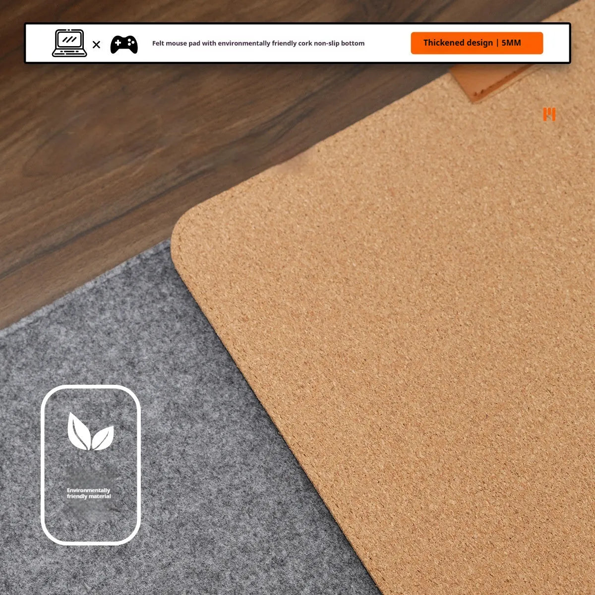 Oversized grey felt and cork desk mouse mat shown on a wooden desk with keyboard and mouse.