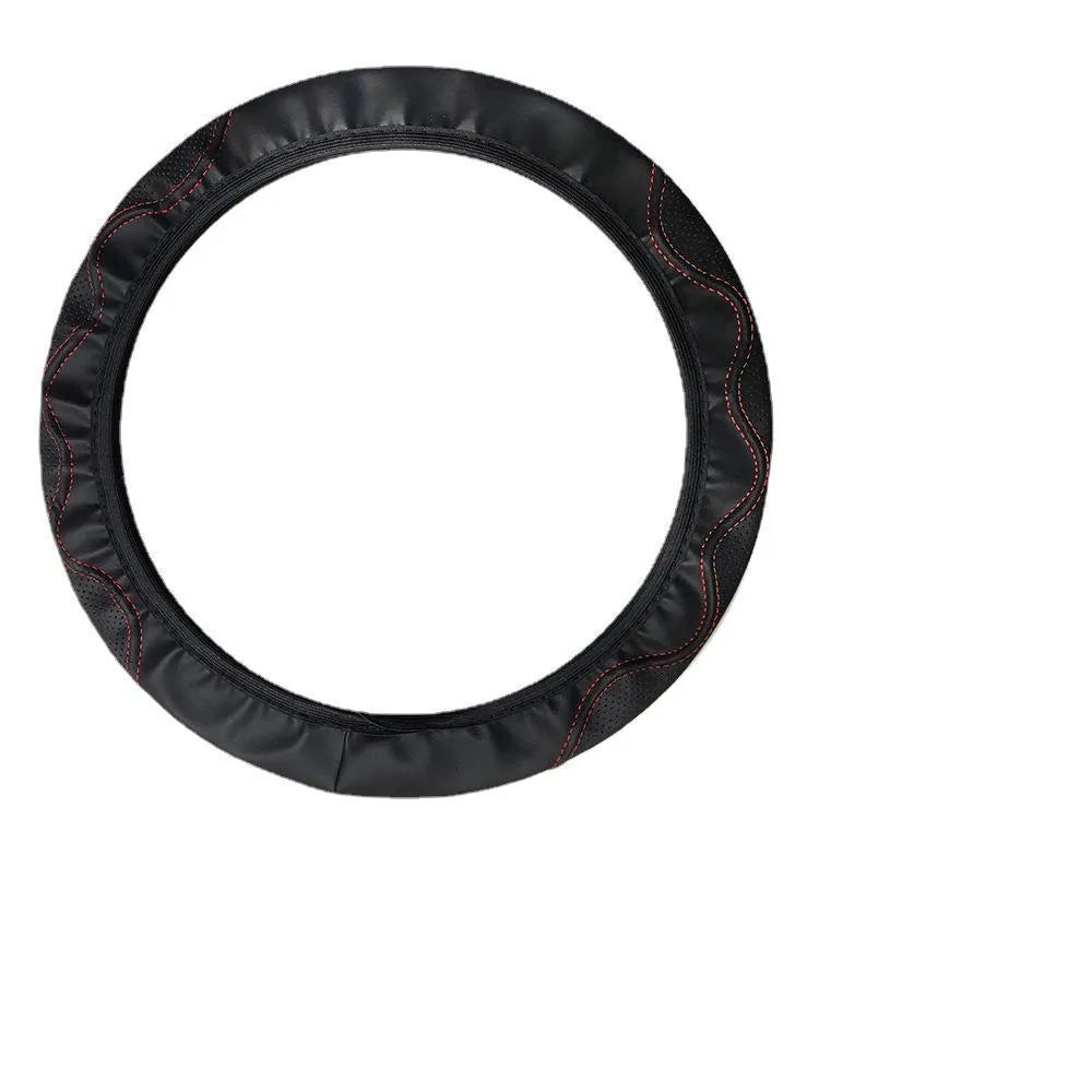Black elastic steering wheel cover with a corrugated texture, stretched to show its fit.