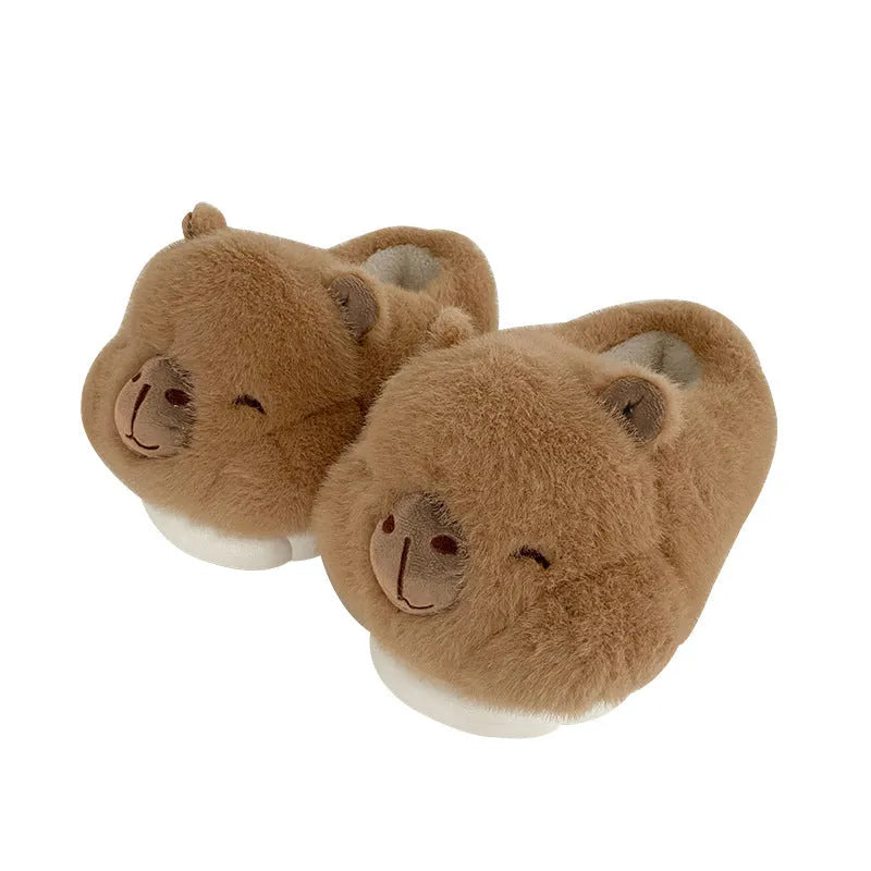 Light brown women's plush winter slippers with cartoon pattern and oversleeve design.