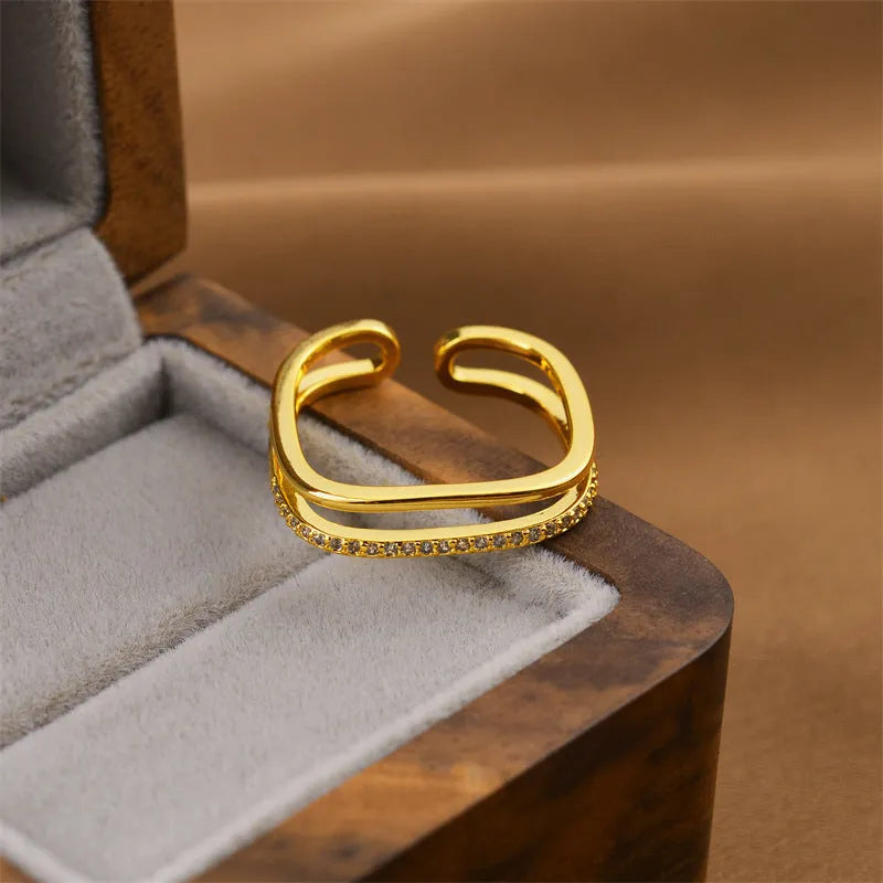 Gold electroplated copper geometric open ring in Korean fashion style, showing adjustable design.