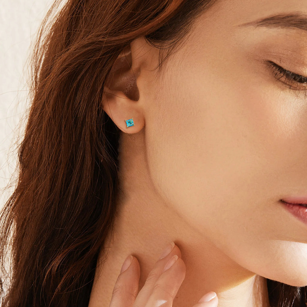Gold-plated brass drop earrings with pear-shaped cubic zirconia stones in a candy colour.