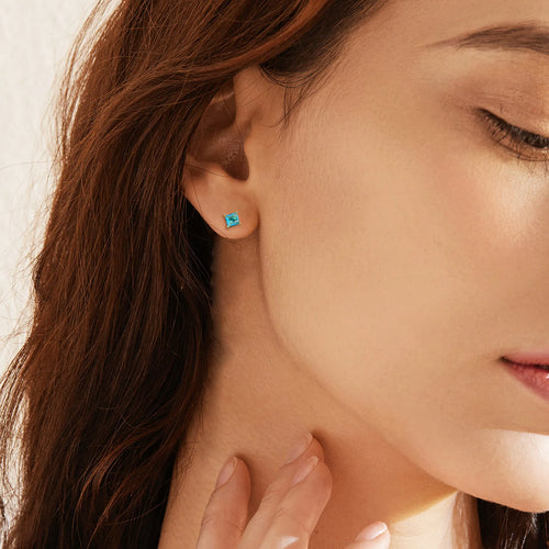 Gold-plated brass drop earrings with pear-shaped cubic zirconia stones in a candy colour.