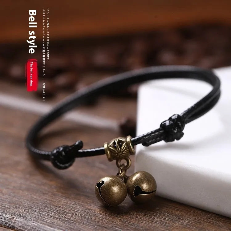 Adjustable nylon dog collar with a choice of brass bell or brass buckle in black, red, or coffee colour.