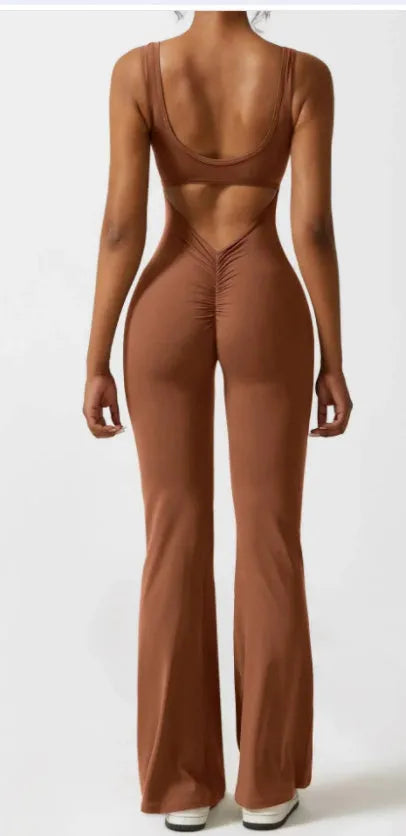 Women's black milk silk yoga bodysuit with seamless design and mid waist.
