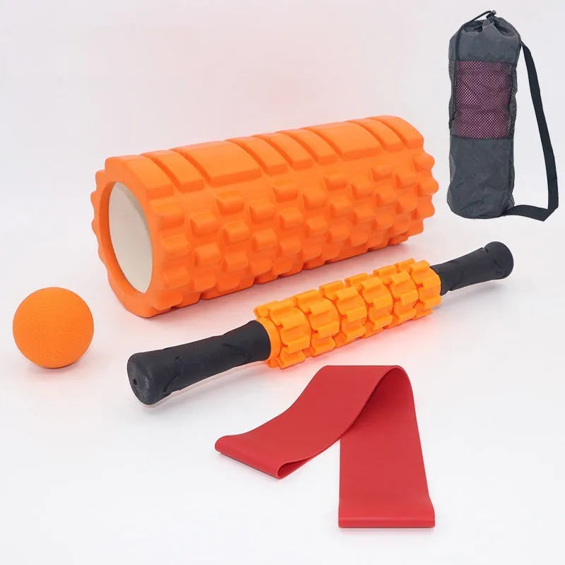 33cm long black foam roller massage stick with six raised gear pieces along its shaft.