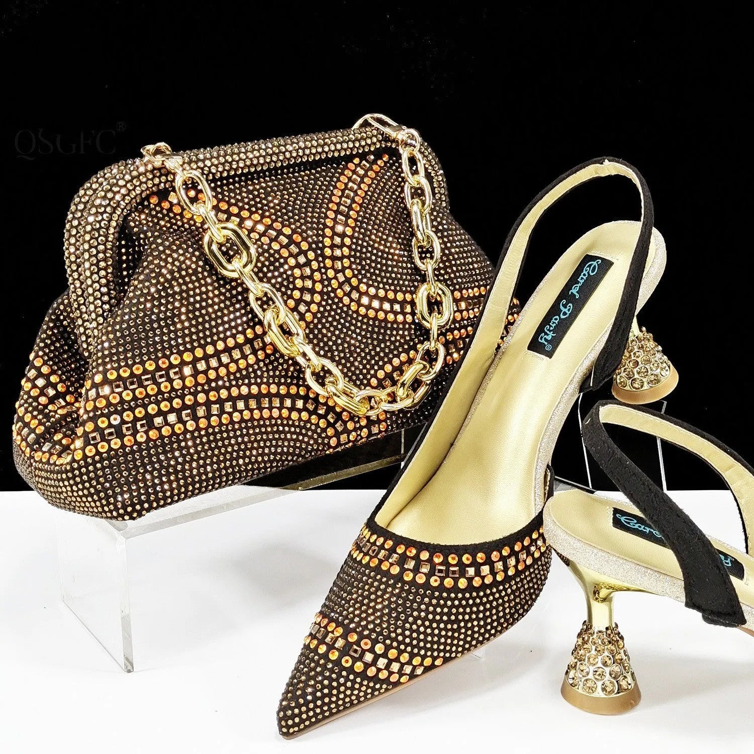 Women's pointed toe high heel shoes with decorative rhinestones and a matching small bag, shown in blue.