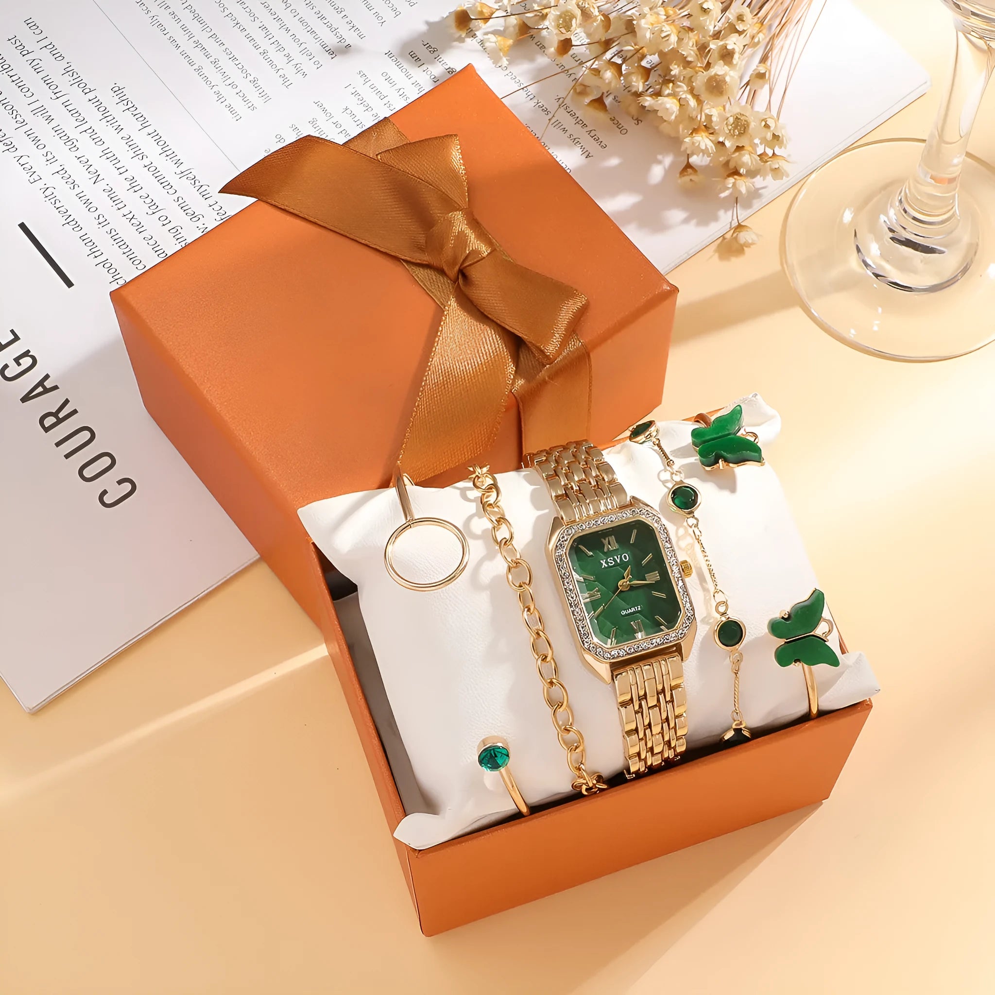 Gold green square women's watch with four matching bracelets on a white background.