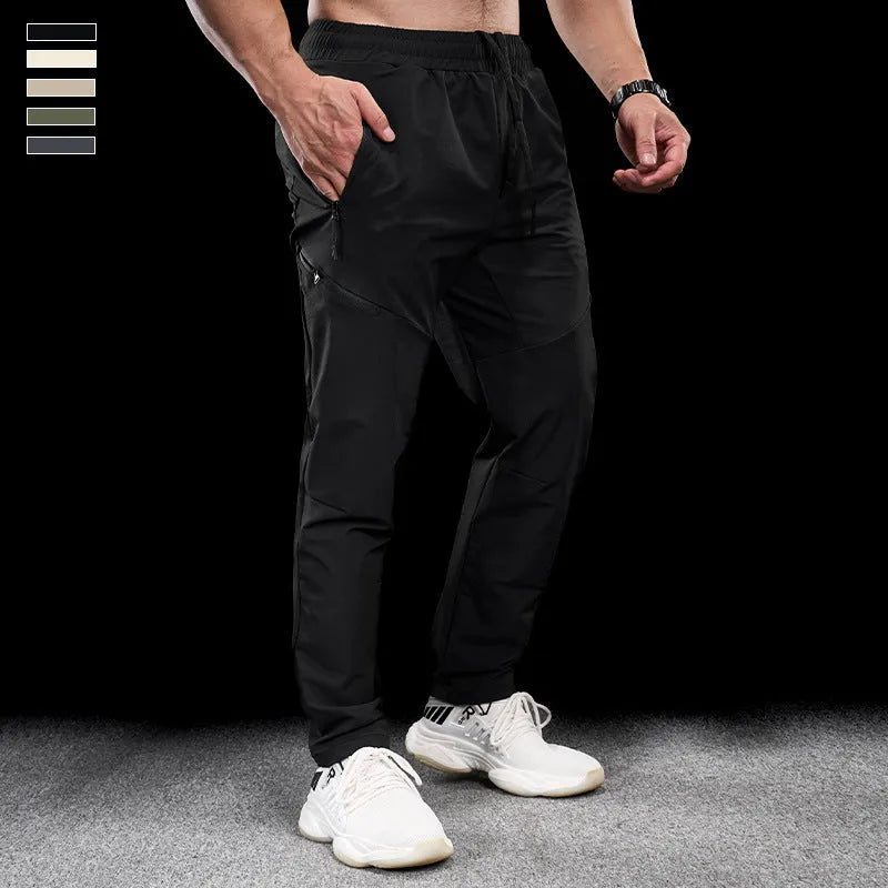 Men's waterproof quick-drying nylon workout trousers in Army Green colour showing mid waist design
