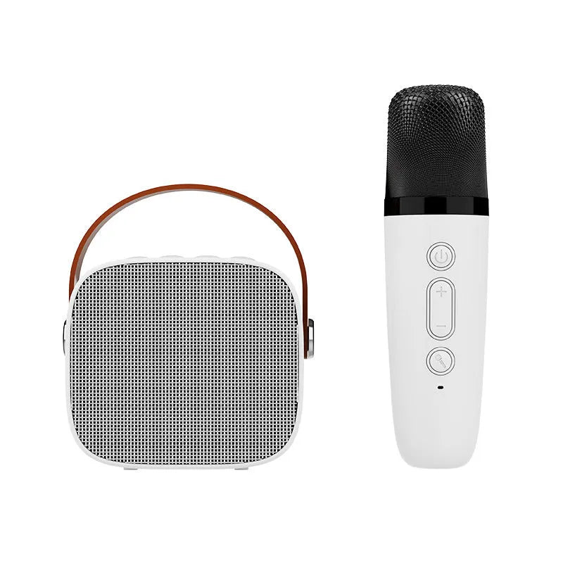 Small white portable Bluetooth speaker with a built-in microphone on a table.