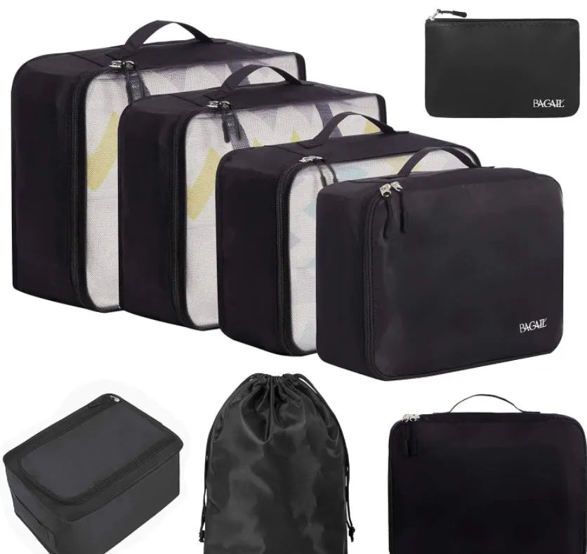 Set of eight PP packing cubes in various colours including beige, black, pink, and leopard print for travel organisation.