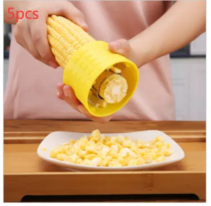 Yellow manual corn thresher kitchen tool with corn-shaped design and stainless steel gear