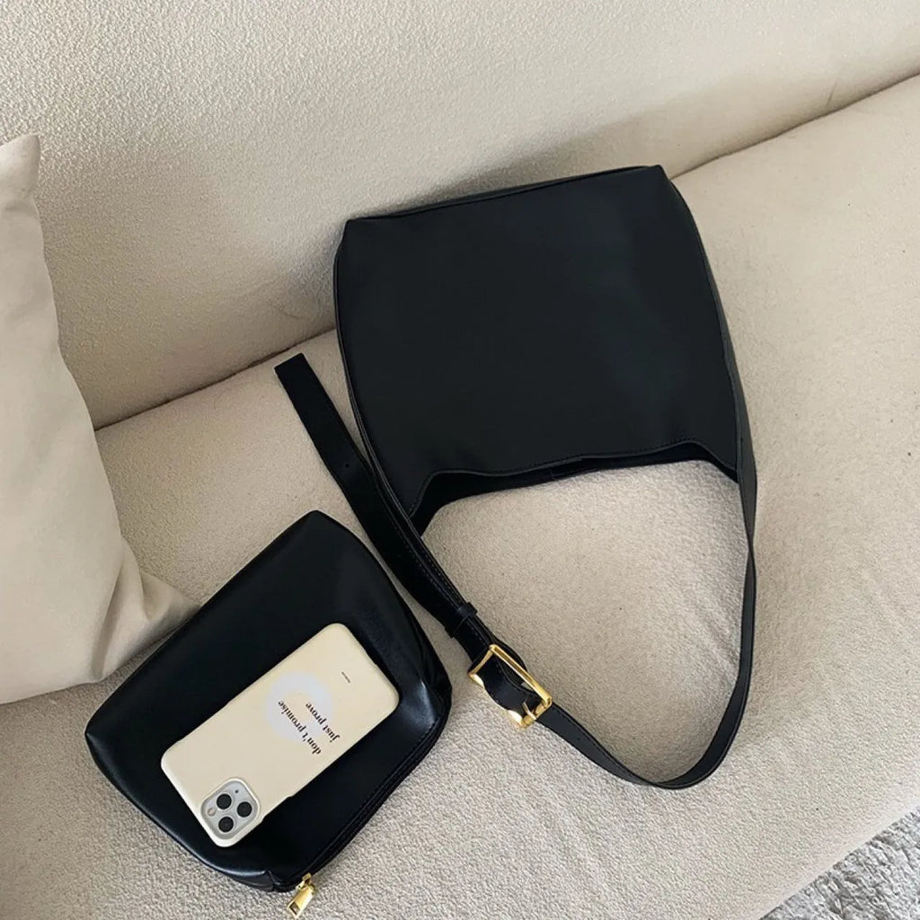 Women's soft PU leather shoulder bag with swing thread detailing in black or brown colour options