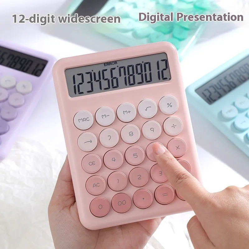 Dopamine gradient colour desk calculator in violet, pink, blue, and green options on a desk