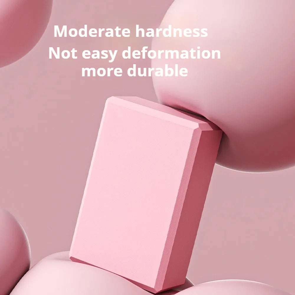 Solid colour EVA foam yoga block measuring 23x15x7.6cm with textured ridges for grip