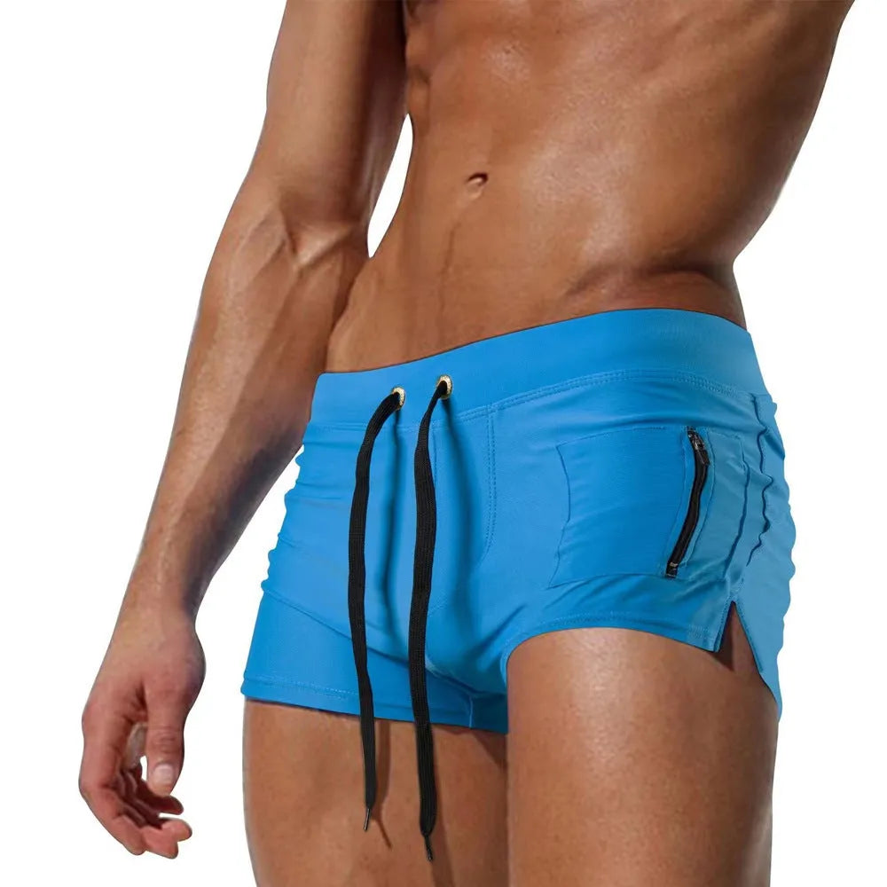 Men's black high-waist swimming trunks with a lace-up front and briefs style.