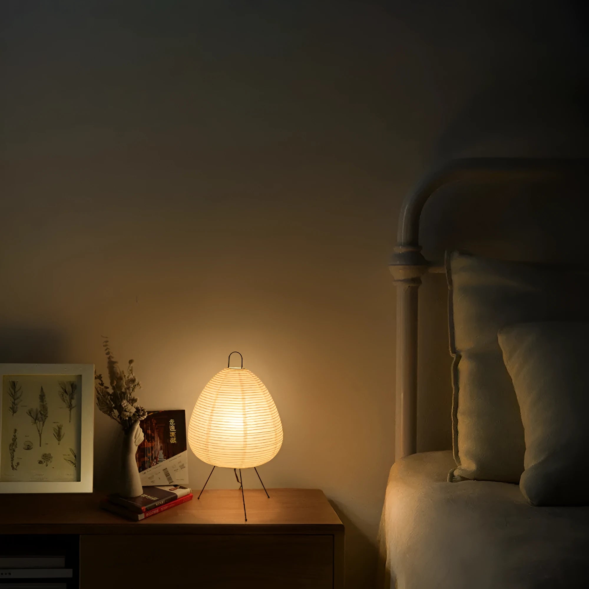 Japanese style rice paper table lamp with aluminium body and decorative shade on wooden surface