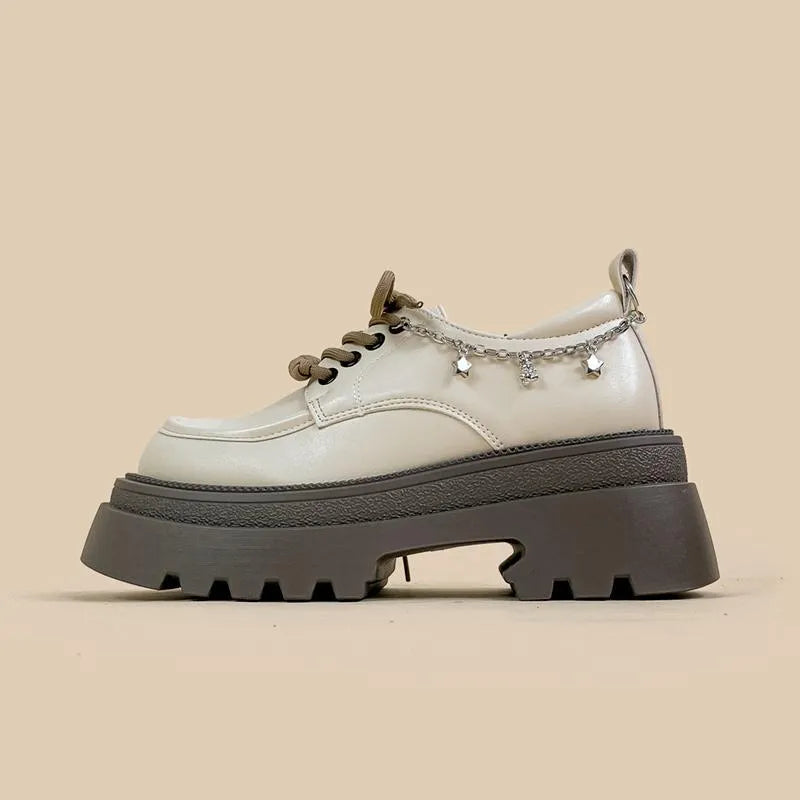 White Amy And Mai PU leather Mary Jane platform shoes with chunky heel and lace-up front.