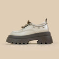 White Amy And Mai PU leather Mary Jane platform shoes with chunky heel and lace-up front.