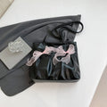 Black and pink college style bow tote bag with double straps and a front view.