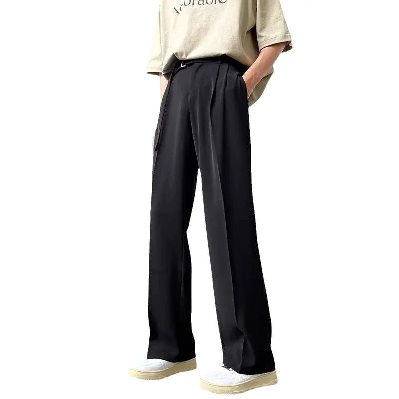 Black wide leg straight trousers with a loose casual fit on a hanger.