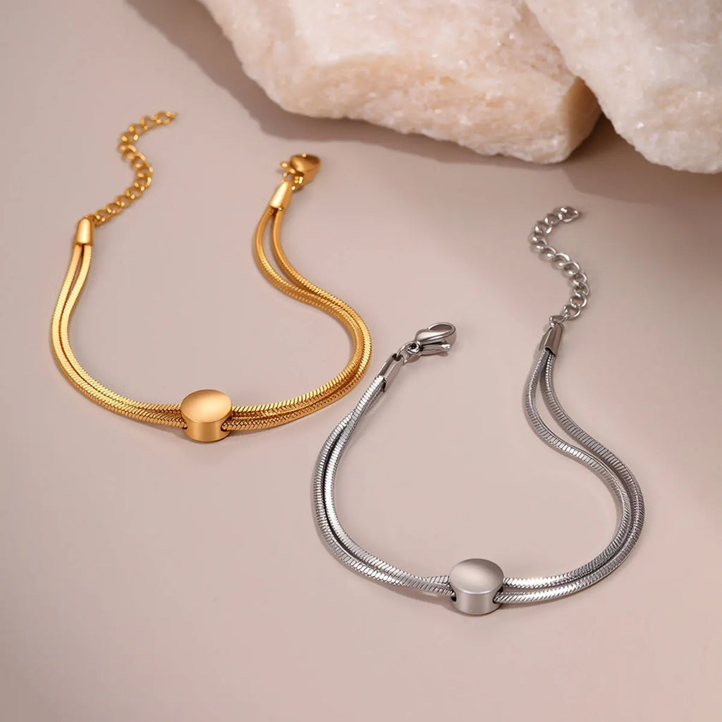 Women's 18K gold plated titanium steel snake chain bracelet on wrist