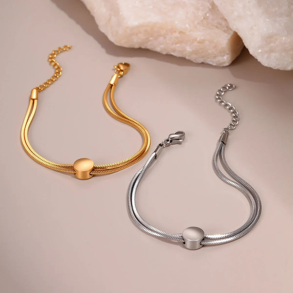 Women's 18K gold plated titanium steel snake chain bracelet on wrist