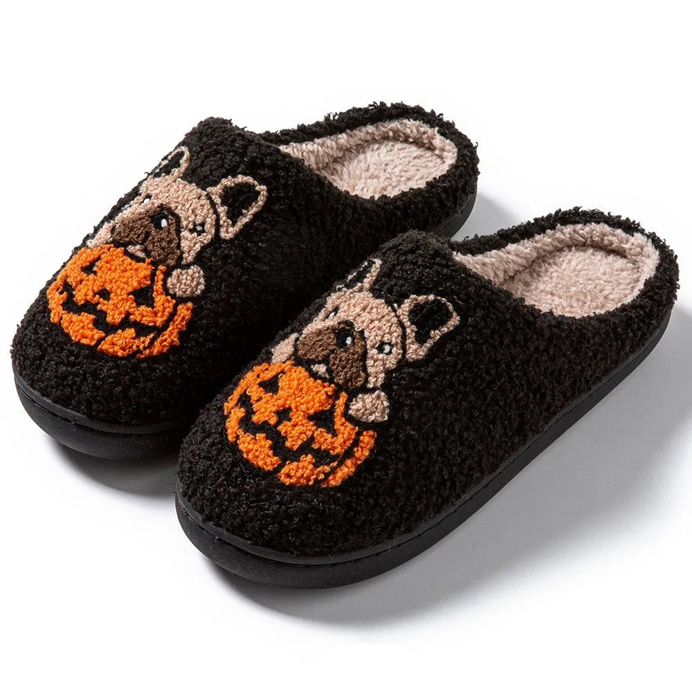 Black and white Halloween slippers with pumpkin patterns and plush fabric construction