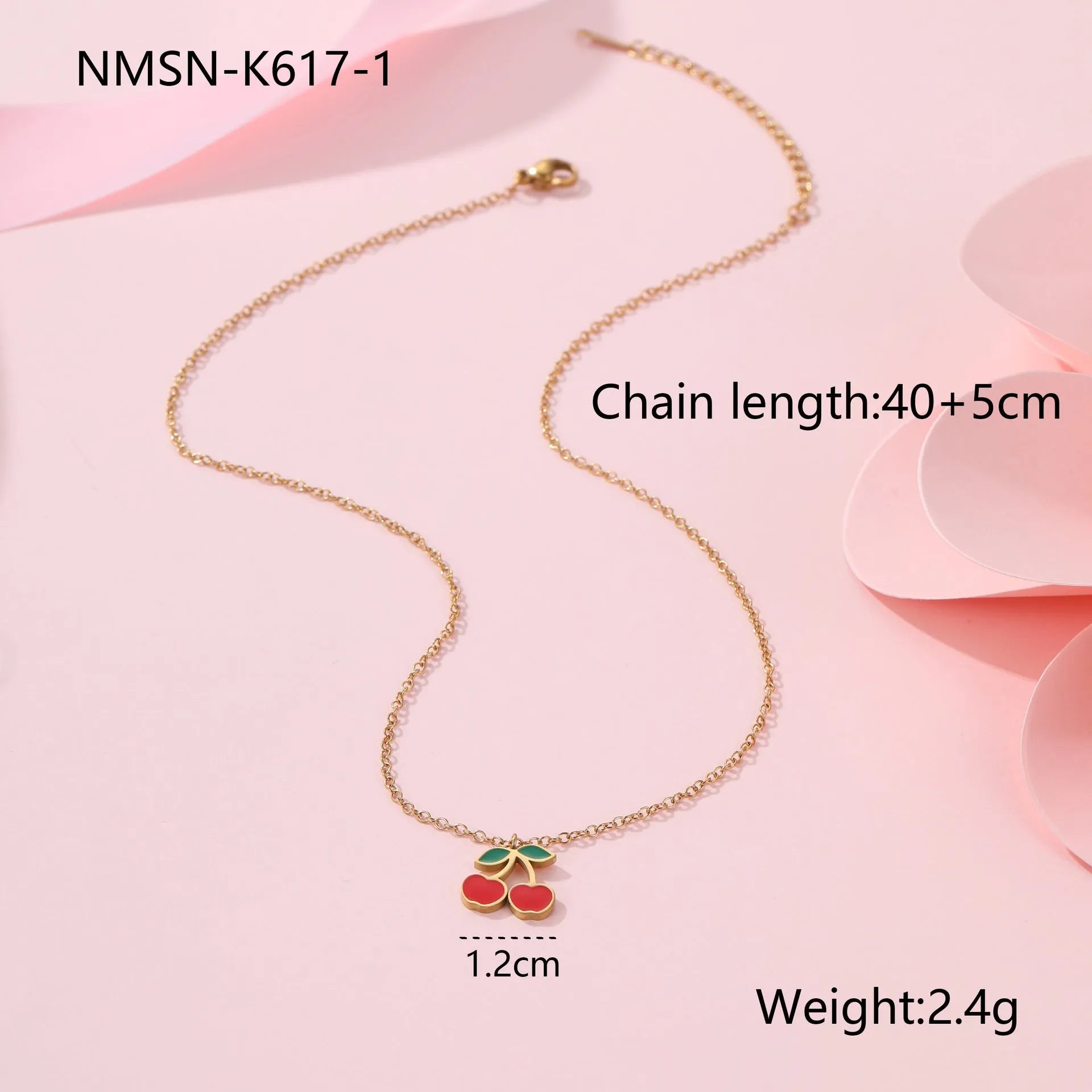 Cherry-themed jewellery set showing stainless steel necklace, bracelet, earrings, and ring with 18K gold plating.