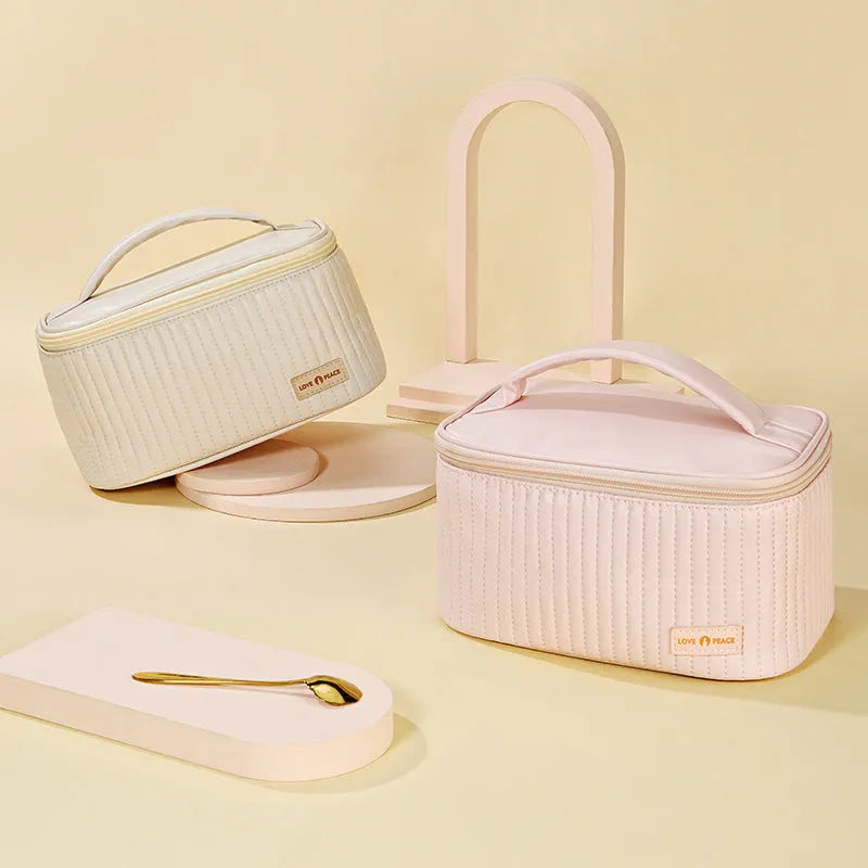 Open-top cake-shaped women's makeup bag in PU leather, shown in a choice of six solid colours.