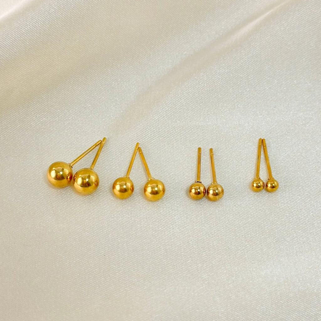 Stainless steel ball stud earrings in gold and silver colours with geometric round design