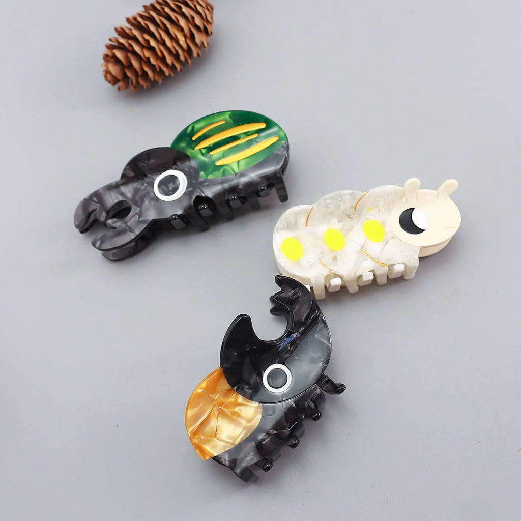 Handmade cellulose acetate insect biology beetle grip with cartoon beetle and caterpillar designs