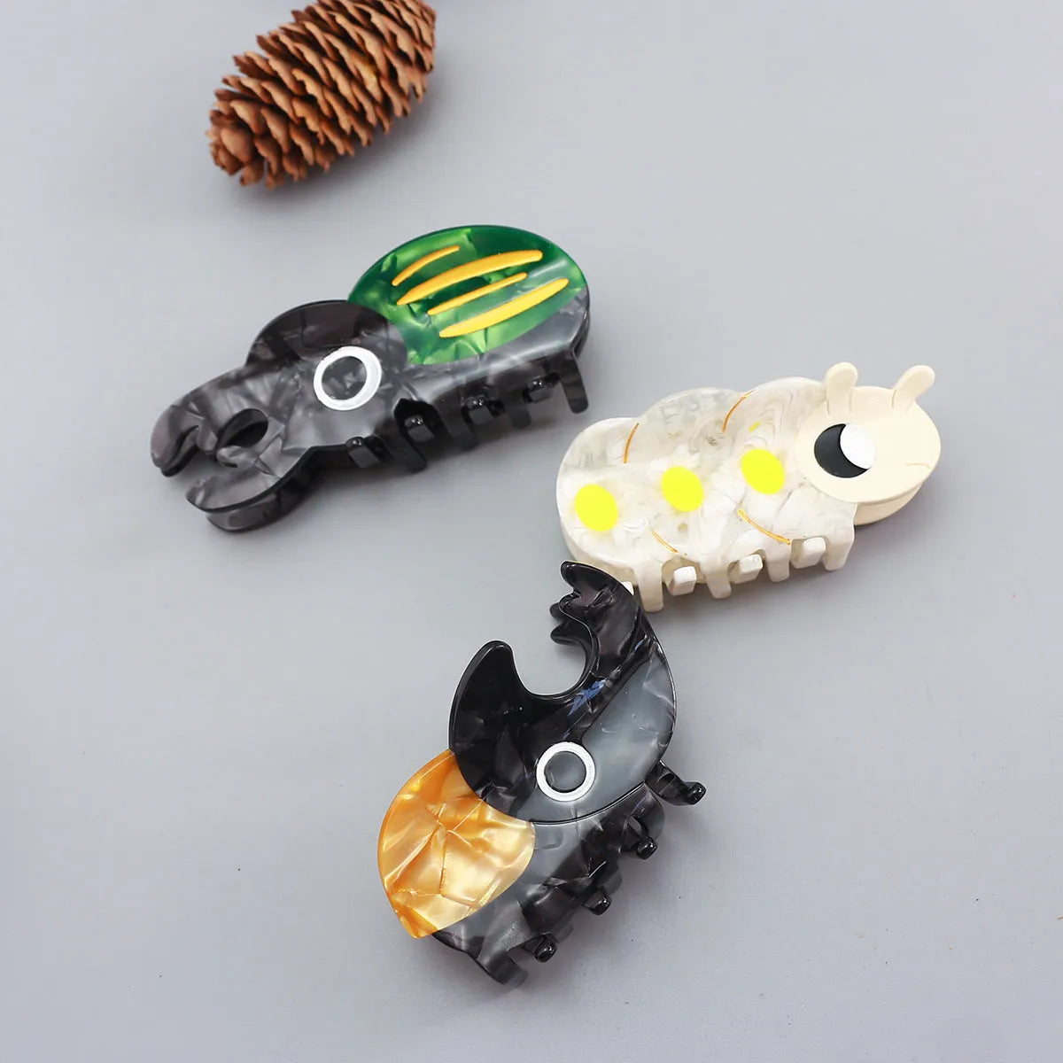 Handmade cellulose acetate insect biology beetle grip with cartoon beetle and caterpillar designs