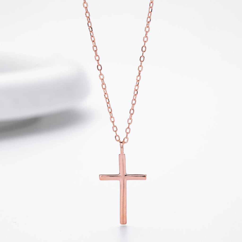 S925 sterling silver necklace showing simple glossy cross pendant on O-shaped chain in gold plating