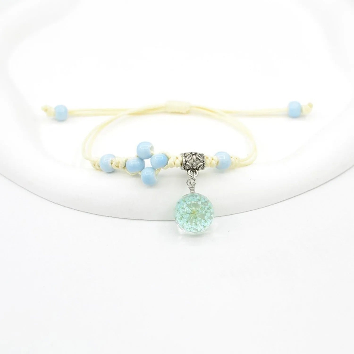 Glass dried flower bracelet with large 1.4cm beads containing real preserved flowers in hand-woven design