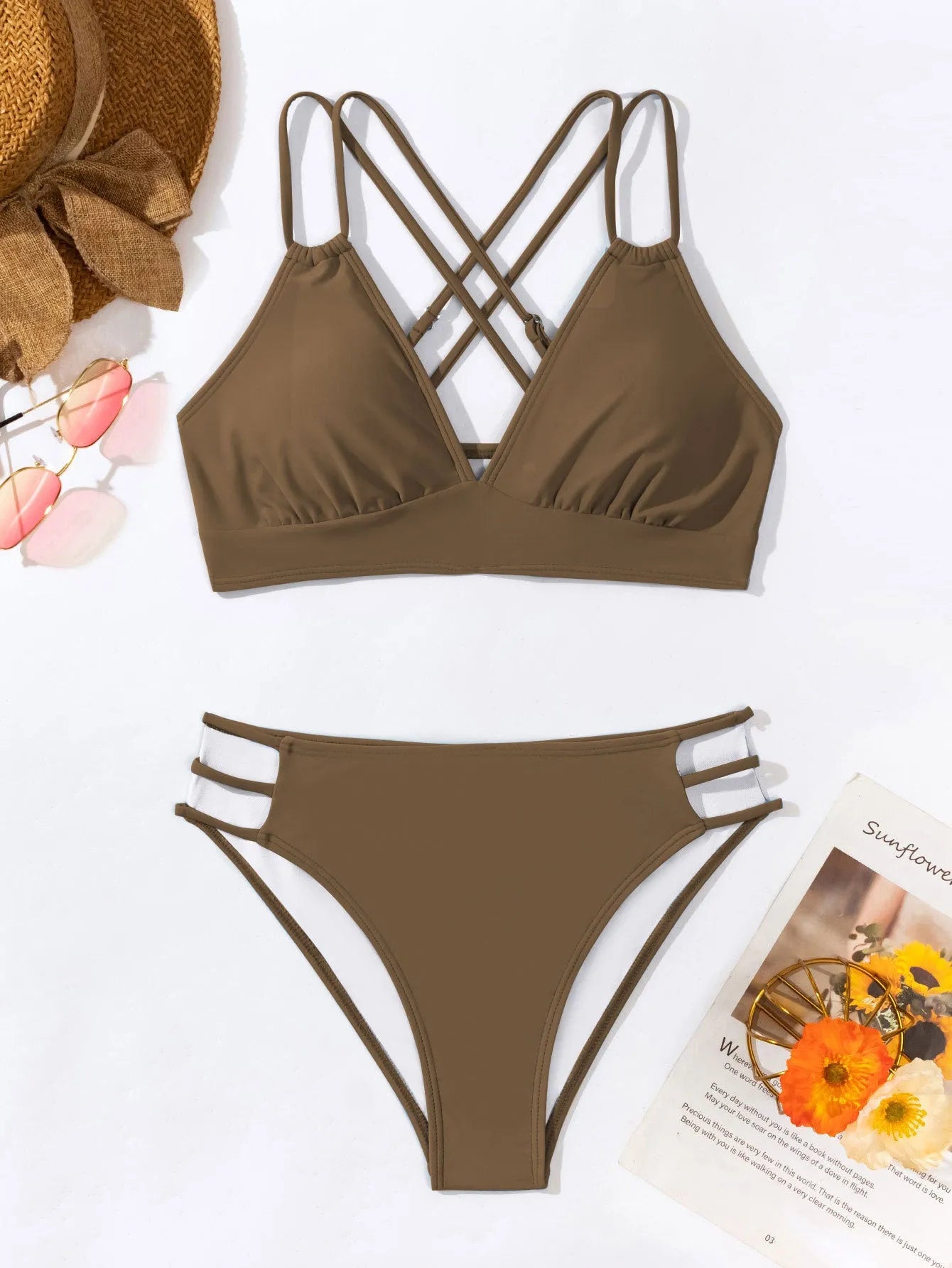 Women's black V-neck halter bikini with split-style shorts on a mannequin.