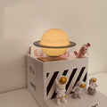 Maglev planet night light floating above base with LED illumination showing detailed planet surface