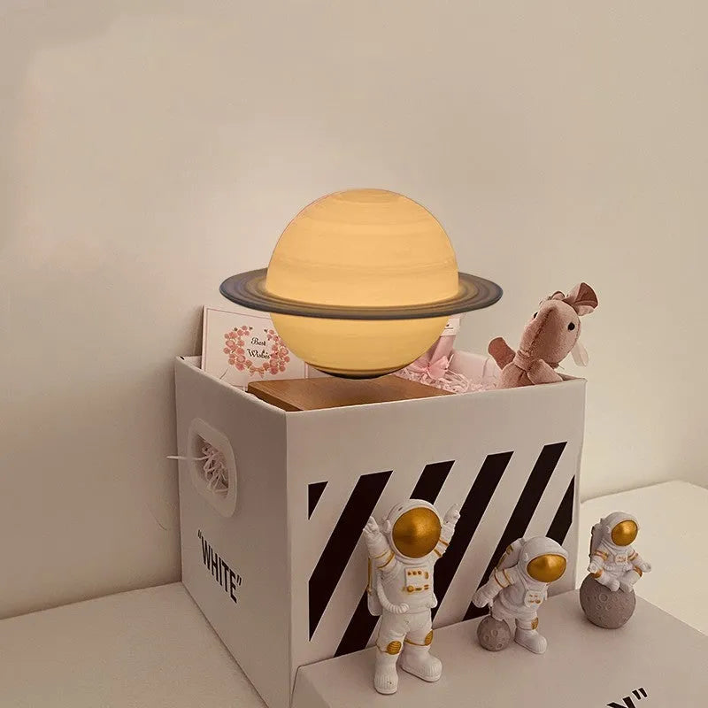 Maglev planet night light floating above base with LED illumination showing detailed planet surface