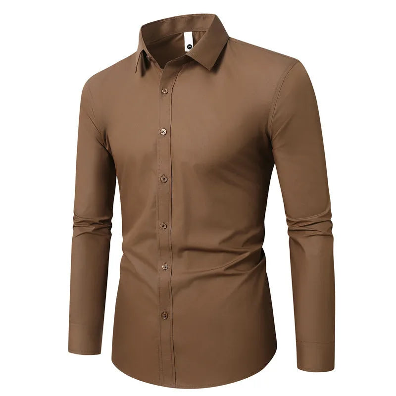Man wearing a loose fit long-sleeve linen shirt in a neutral colour, showcasing the casual silhouette.