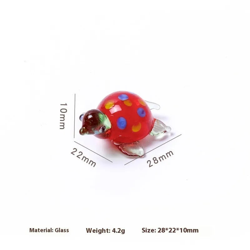 Geometric glass turtle desktop ornament in modern simplicity style on a wooden surface.