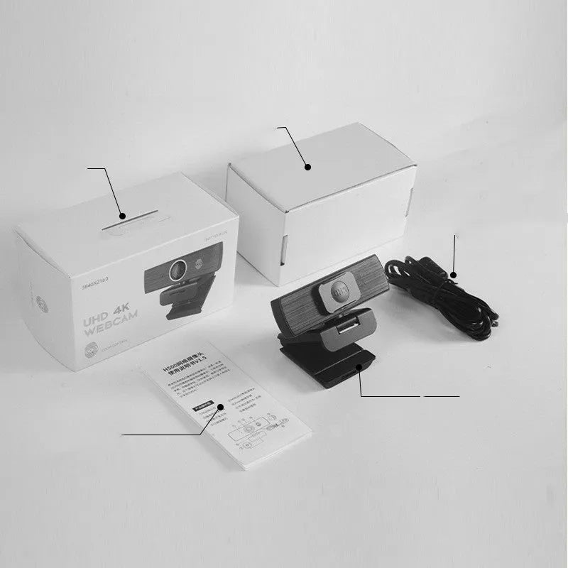 Black 8MP 4K USB computer webcam with magnetic privacy cover on a desktop